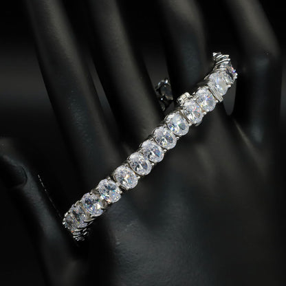 A 925 sterling silver tennis bracelet featuring egg-shaped zircon stones. This elegant bracelet showcases a series of sparkling zircon gems set in polished silver, with a delicate yet secure clasp. Perfect for adding a touch of sophistication and glamour to both casual and formal outfits, offering a timeless and luxurious accessory