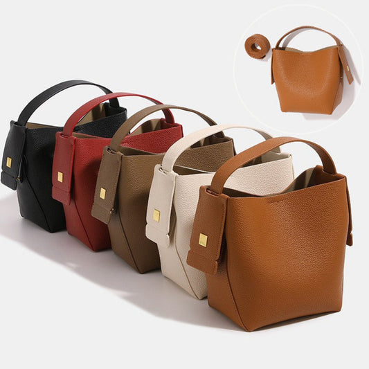 A vintage-style commuter leather shoulder bag in brown, featuring a sleek, rectangular shape with smooth, durable leather. It includes a wide adjustable shoulder strap for comfort and a spacious interior for essentials like documents, electronics, and everyday items. Perfect for professional or casual use with a timeless, versatile design