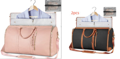 Waterproof travel duffle handbag in a sleek design, featuring sturdy handles and a detachable shoulder strap, set against a scenic outdoor backdrop