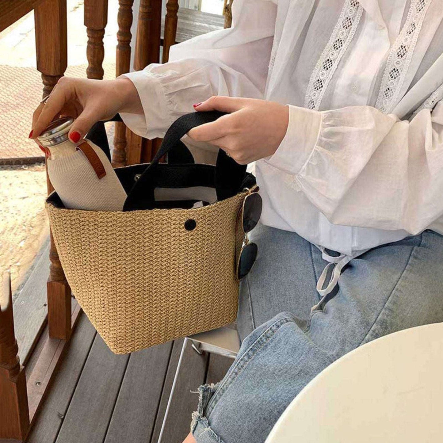 Straw shoulder bag with bucket shape, casual and trendy design, made from rattan, available in black and white, perfect for women’s daily use