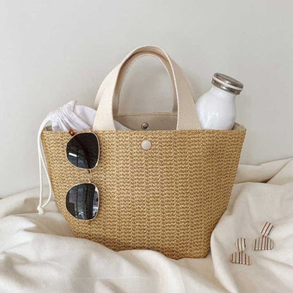 Straw shoulder bag with bucket shape, casual and trendy design, made from rattan, available in black and white, perfect for women’s daily use