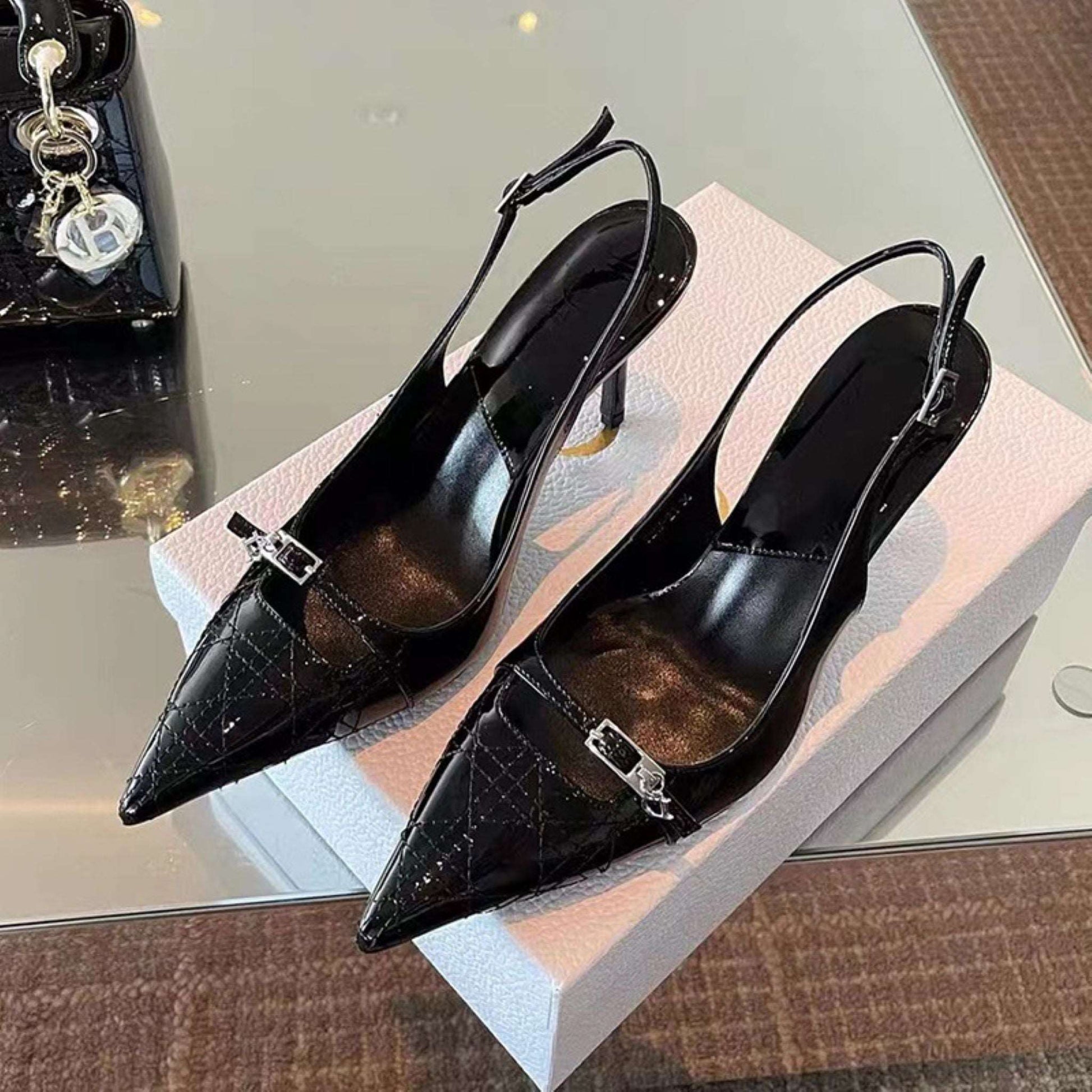 Sleek slingback stiletto heels with a classic pointed toe design, offering a sophisticated and stylish look. These heels are ideal for both formal events and stylish everyday wear