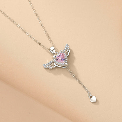  Delicate Cupid-inspired necklace featuring a heart charm with wings and elegant tassels, creating a romantic and whimsical look. Perfect for adding a touch of charm and personality to any outfit.