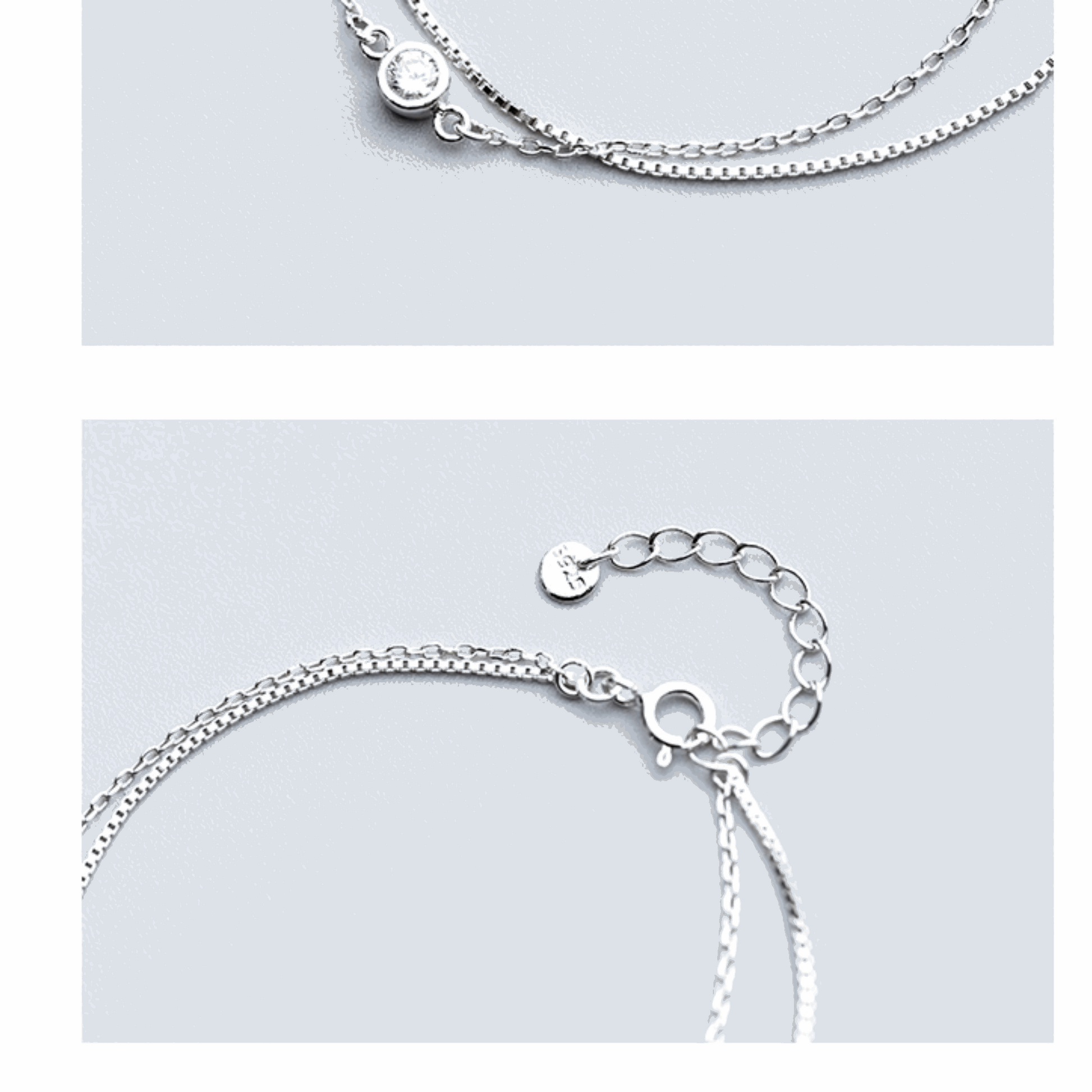 Stunning double-layer silver bracelet adorned with shimmering diamonds. This elegant piece offers a modern yet timeless design, perfect for adding a touch of glamour to any outfit.