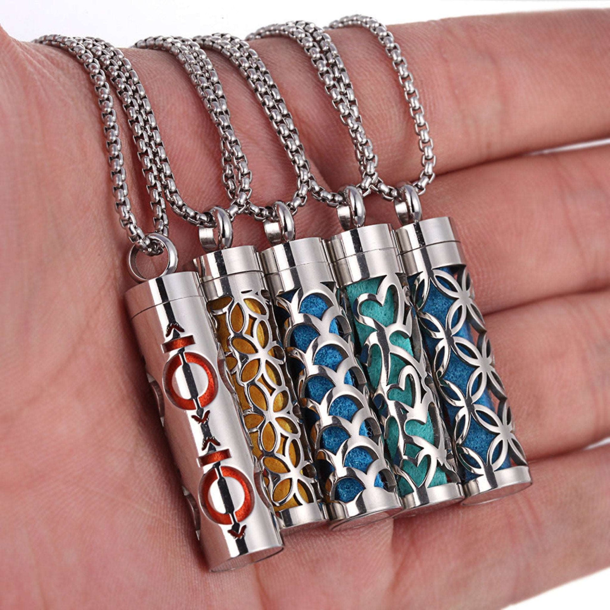 Stylish pendant necklace with an essential oil diffuser, featuring an intricate design that allows for a subtle release of fragrance, perfect for a personal, on-the-go aromatherapy experience.