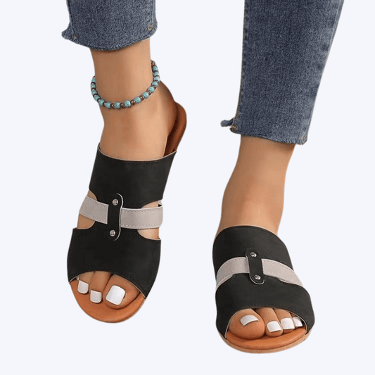 Fish mouth sandals with belt buckle for women. Features a suede upper, leather lining, and rubber sole for beach use