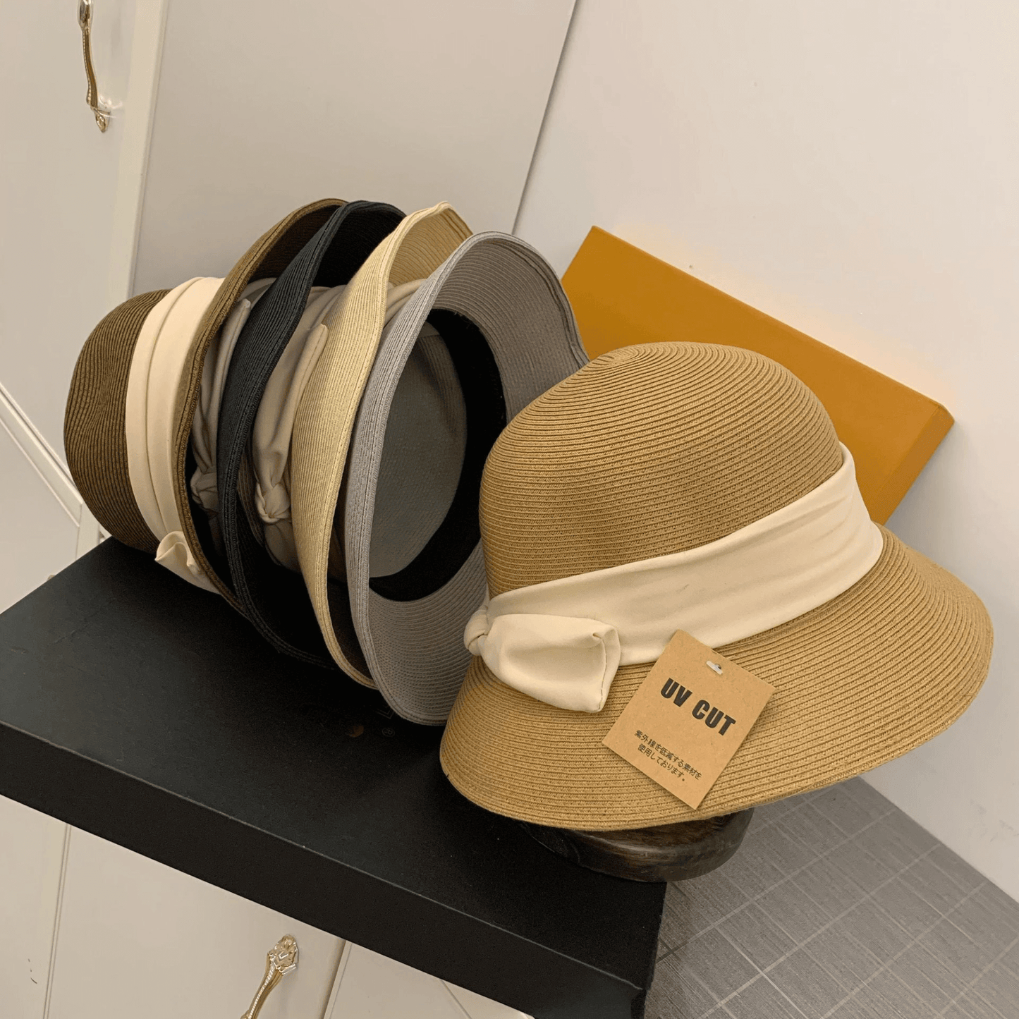 Foldable Wide Brim Sun Hat for Women, UV protection, breathable straw material, Korean style with bow accent, perfect for summer