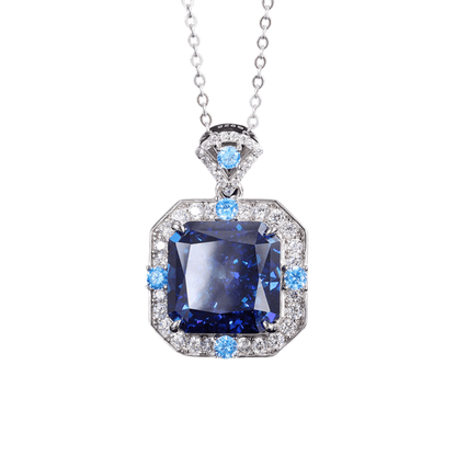 Elegant geometric silver pendant with sapphire blue and emerald accents, ideal for women’s casual or formal wear, versatile jewelry