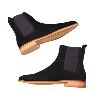 Black leather Chelsea boots for women with elastic side panels, cushioned insoles, and durable rubber soles. Ideal for fall & winter outfits and easy to wear