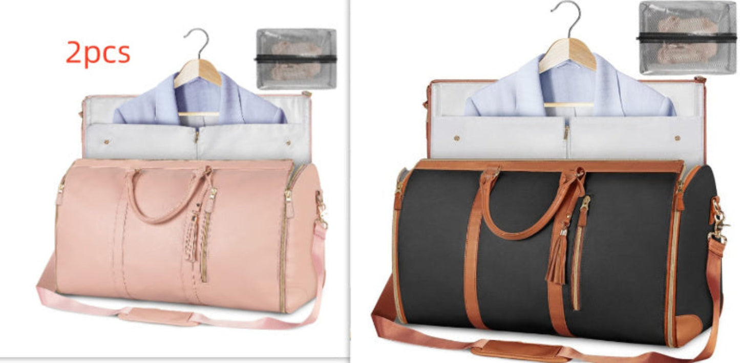 Waterproof travel duffle handbag in a sleek design, featuring sturdy handles and a detachable shoulder strap, set against a scenic outdoor backdrop