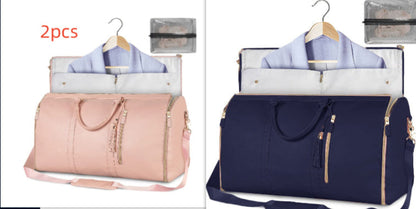 Waterproof travel duffle handbag in a sleek design, featuring sturdy handles and a detachable shoulder strap, set against a scenic outdoor backdrop