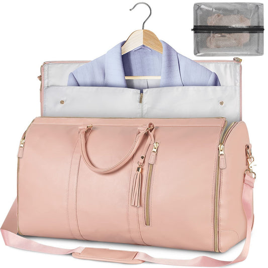 Waterproof travel duffle handbag in a sleek design, featuring sturdy handles and a detachable shoulder strap, set against a scenic outdoor backdrop